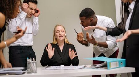 Professionals argue in an office setting
