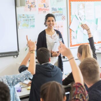 A teacher in a high school classroom